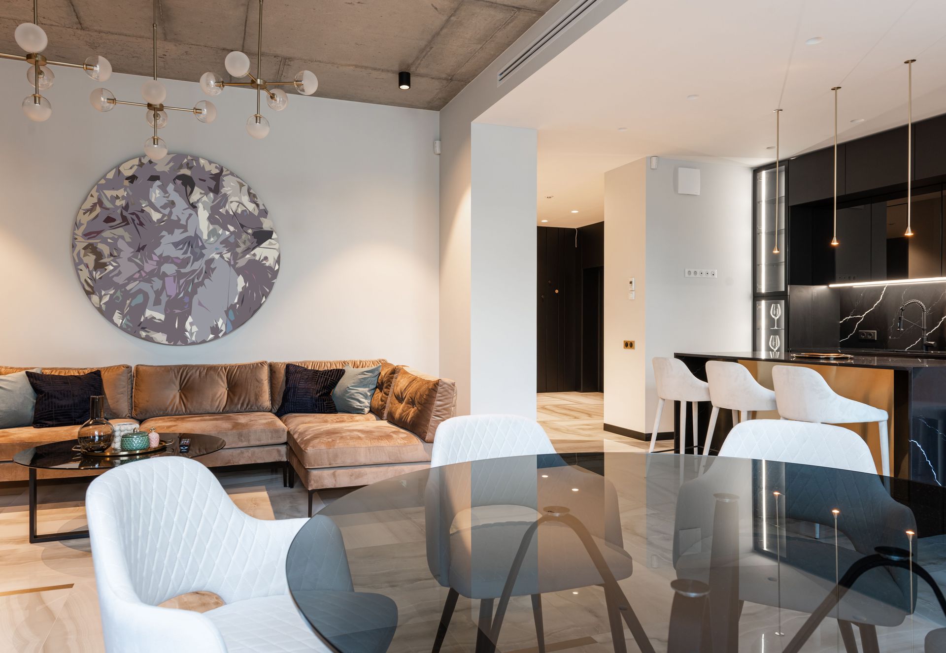 Spacious modern living room with chic decor and open kitchen setup. Perfect for interior design inspiration.